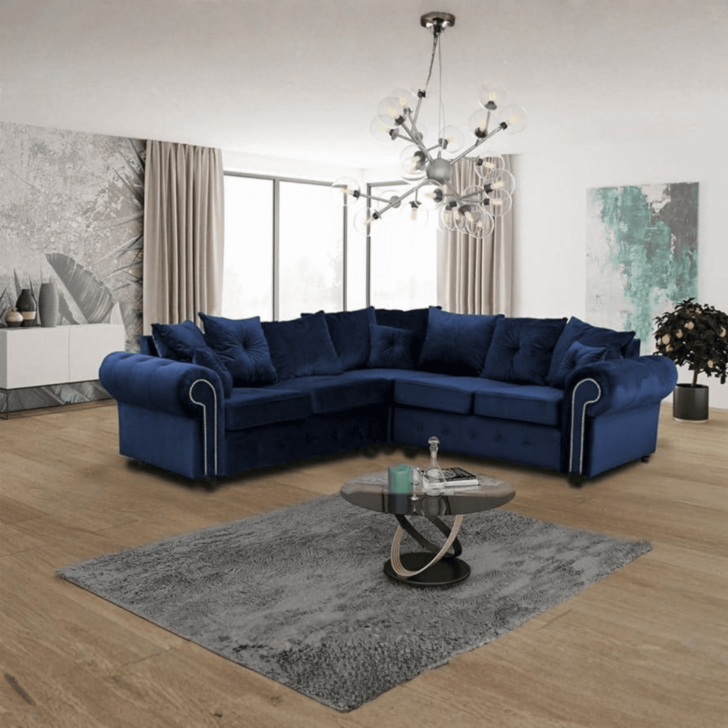 Amazing modern corner sofa dark blue in a contemporary living room with wooden flooring and stylish décor.