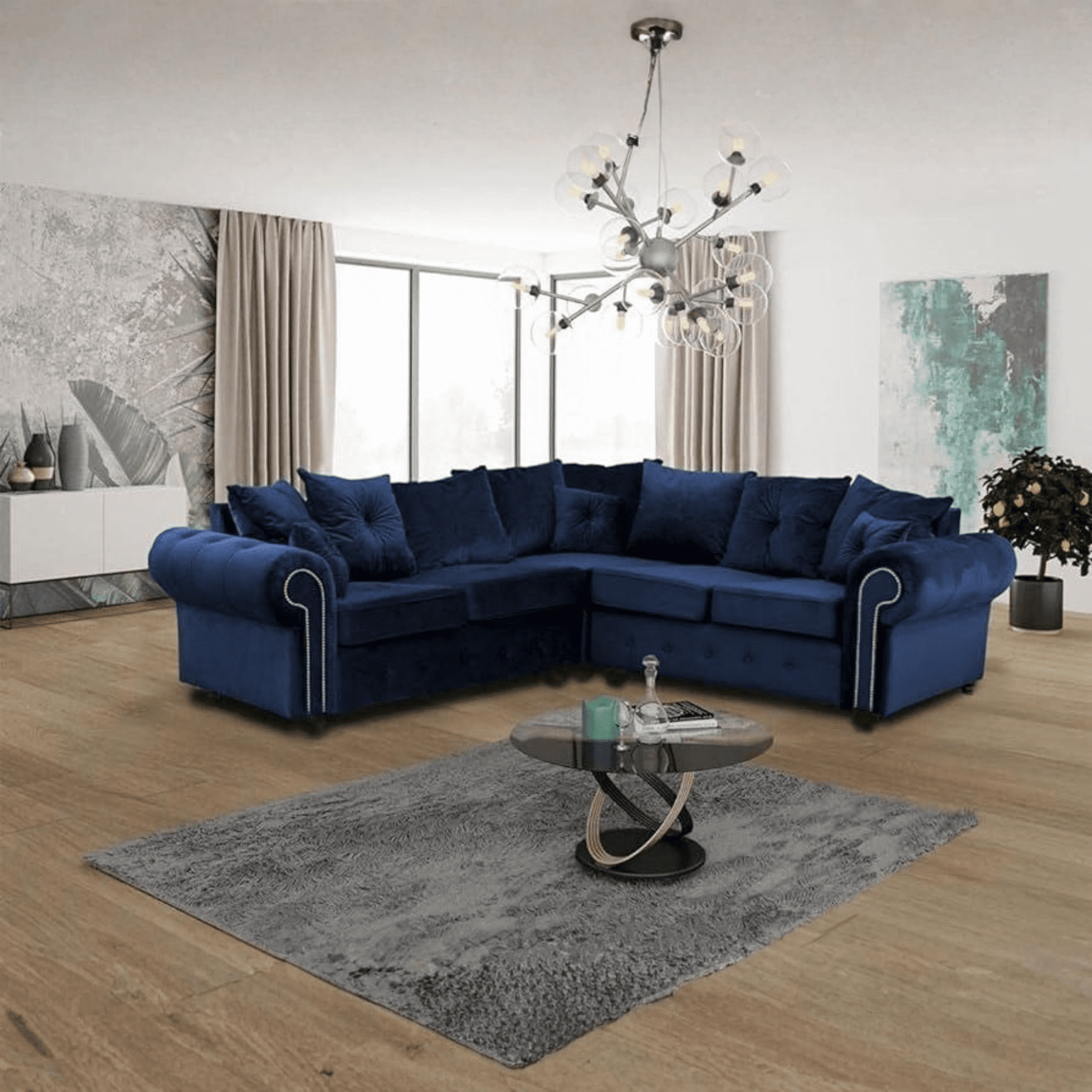 Amazing modern corner sofa dark blue in a contemporary living room with wooden flooring and stylish décor.